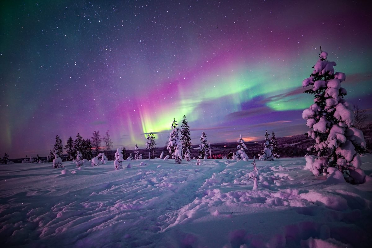 Green and purple auroras over Finnish Lapland